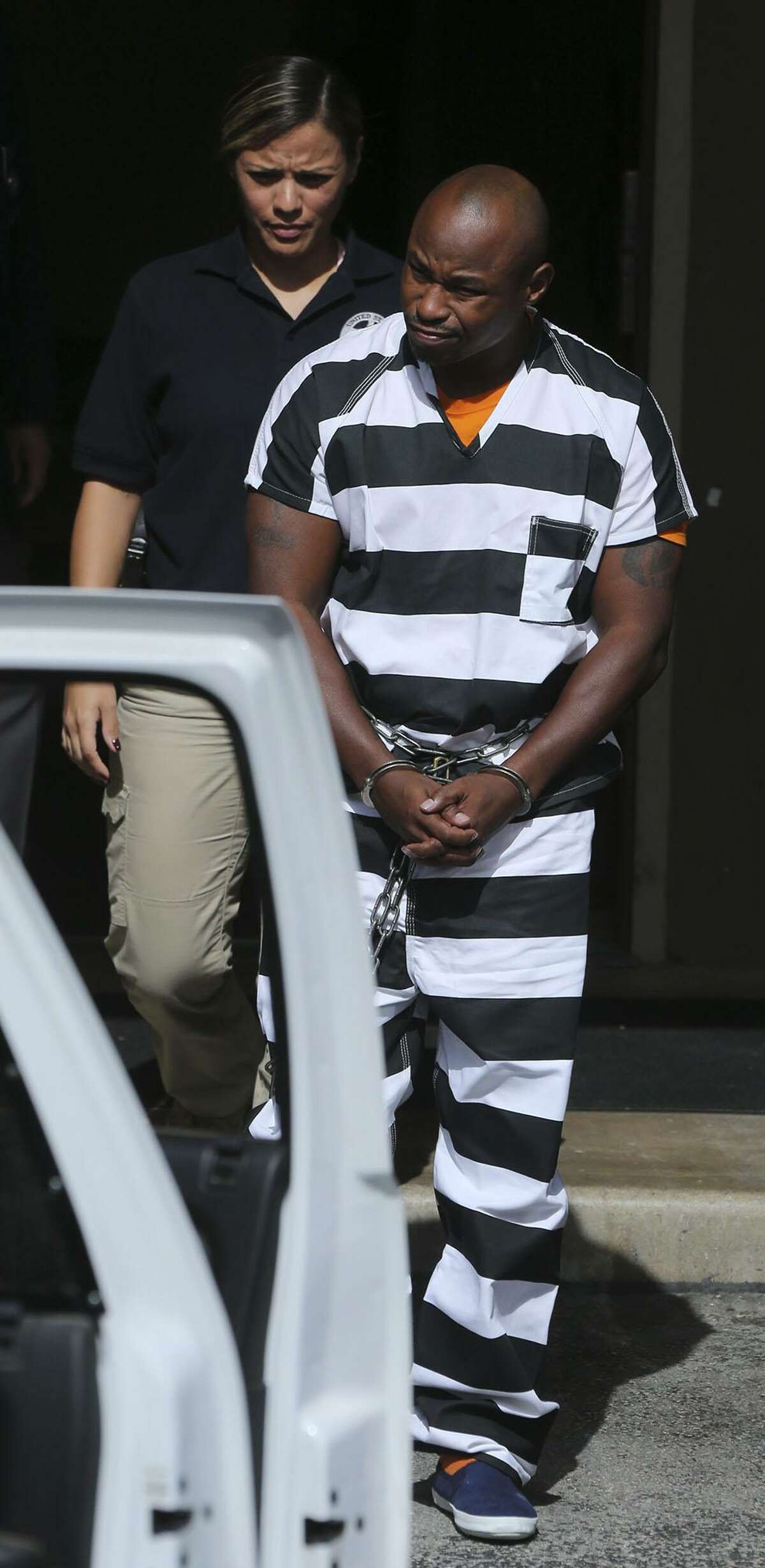 Army Sgt. 1st Class Maliek Kearney,35, is walked to an SUV Tuesday October 18, 2016 at the John H. Wood, Jr. Federal Courthouse after being denied bail. Kearney is fighting a charge that he traveled interstate to kill his wife in Maryland last year.