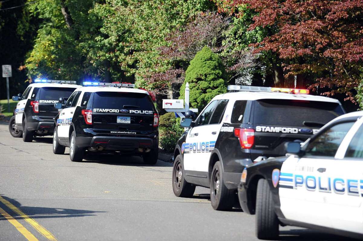Stamford police block off Westwood Rd. after a man barricaded himself inside his home with a gun while making threats in north Stamford, Conn. on Monday, Oct. 17, 2016.