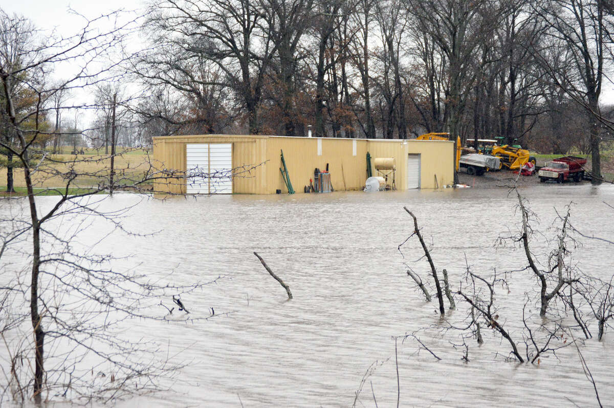 The Oak Brook Golf Club maintenance shed, seen here from Fruit Road, sits under water on Dec. 28 after three days of rain.