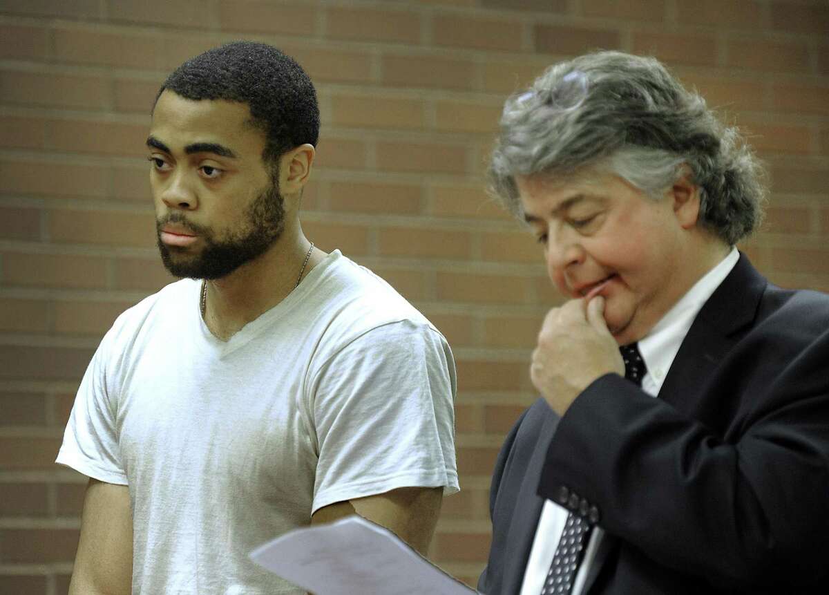 Emanuel Harris, on trial for murder in a 2013 slaying, and his attorney Dante Gallucci.