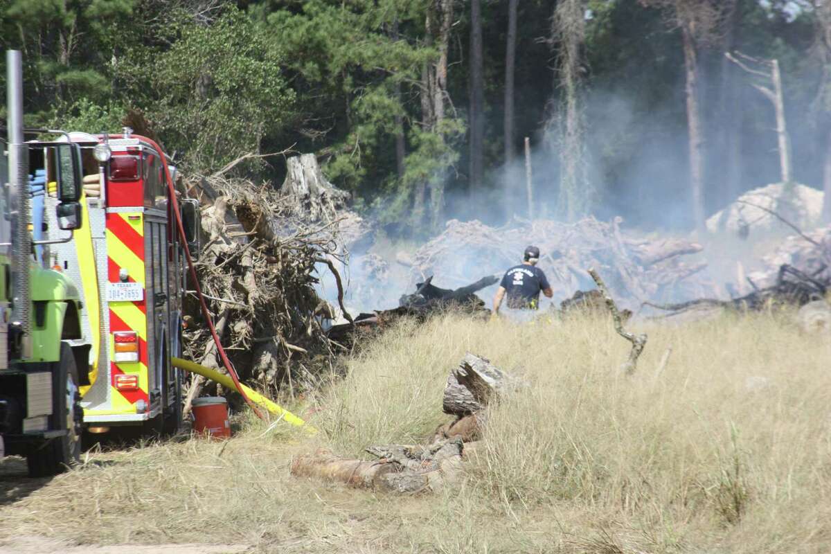 Firefighters from five departments in Liberty County responded to a call for help at the Texas Tech Inc. dump site on Tuesday, Oct. 18. Authorities say several loads of construction debris had intentionally been ignited and the fire was threatening nearby homes because of dry conditions and the volume of available fuel on the ground.
