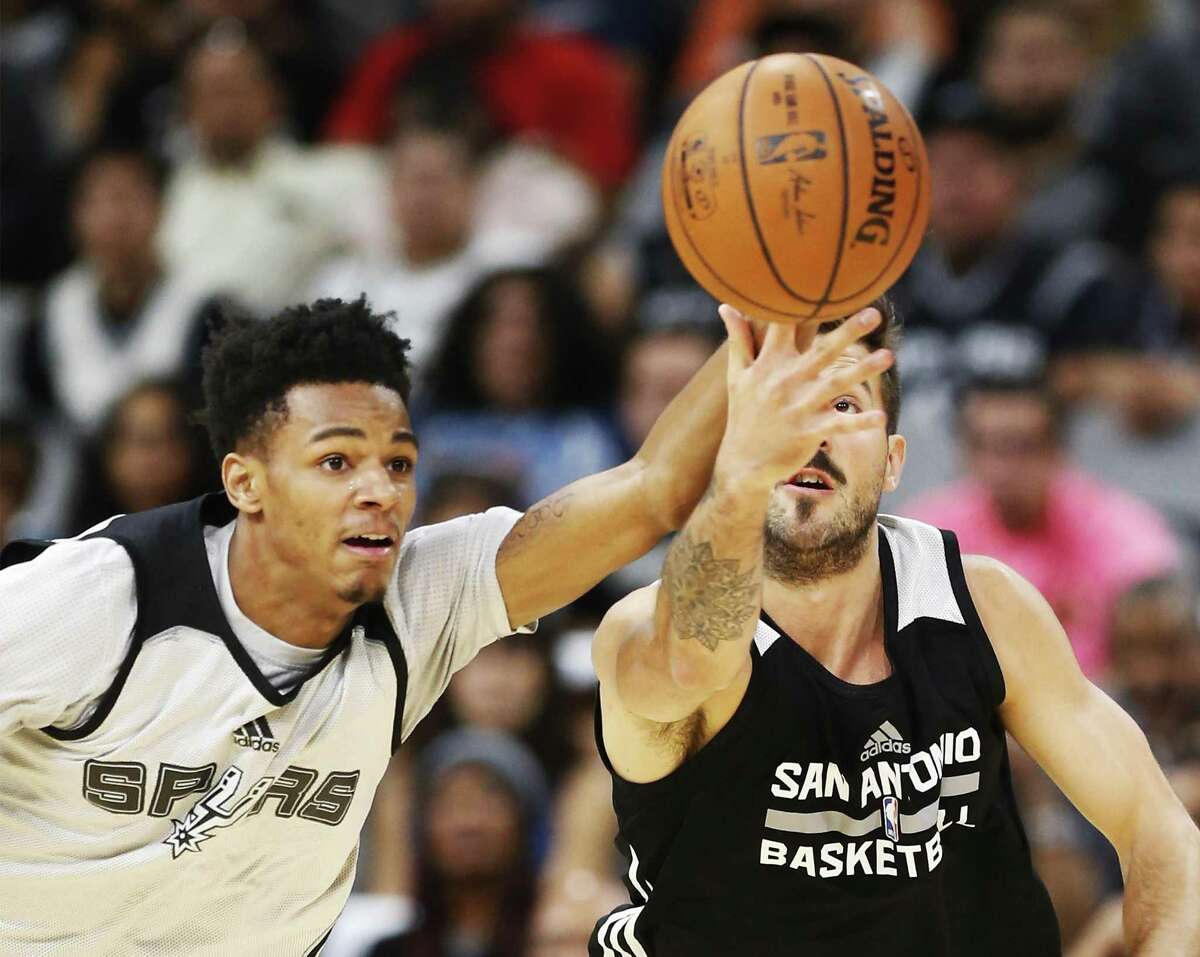 Dejounte Murray (left) and Nicolas Laprovittola battle for a loose ball during the Spurs’ Silver & Black open scrimmage at the AT&T Center on Oct. 18, 2016.