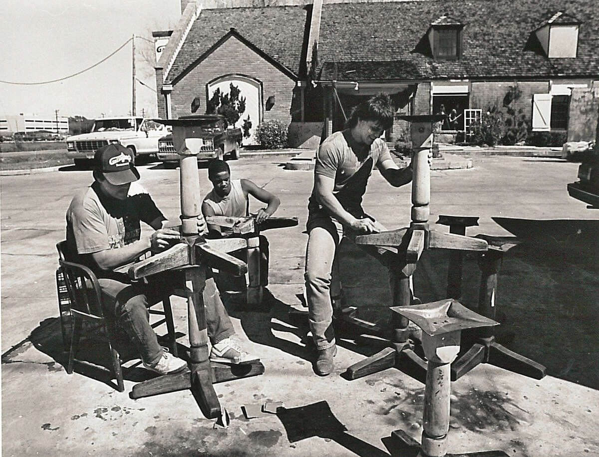 From left, Richard Adams, Arthur Rogers and Kevin Luke sand soot off dining tables at Gallagher's in Beaumont in May of 1986. Enterprise file photo