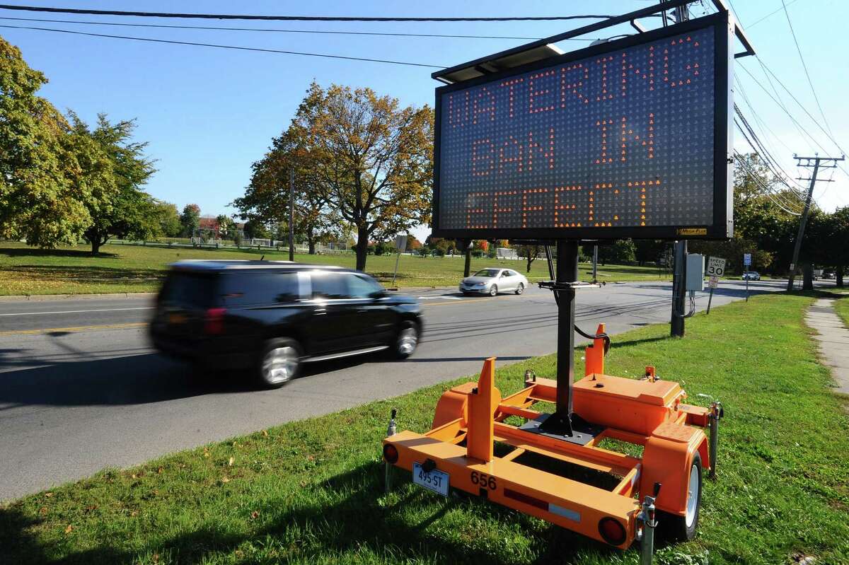 A roadside sign on the corner of Shippan Avenue and Harbor Drive flashes water ban alerts to passing drivers in Stamford on Wednesday.