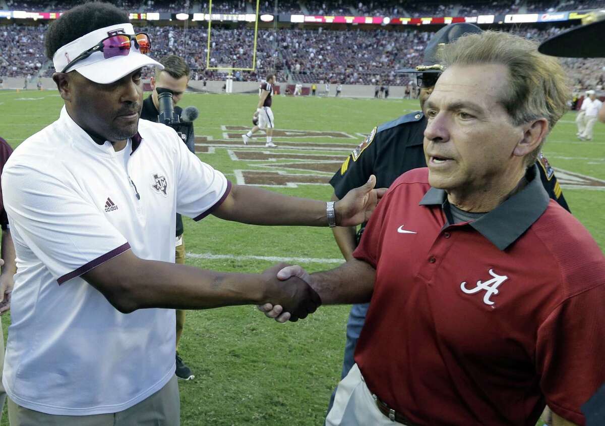 Alabama coach Nick Saban (right) shakes hands with Texas A&M head coach Kevin Sumlin following the Crimson Tide’s 41-23 win over the Aggies on Oct. 17, 2015, in College Station,