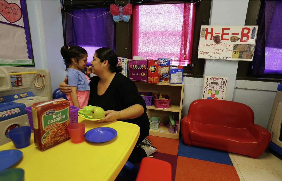 Crystal Lopez gives her 4-year-old daughter, Nova, a hug while she attends day care at the Ella Austin Community Center's Child Development Center on Oct. 19, 2016. Lopez also happens to work at Ella Austin as a teacher. Children at Risk released findings related to the efficiency and transparency of state-funded child care programs, a critical source of early learning for the state’s most vulnerable children.