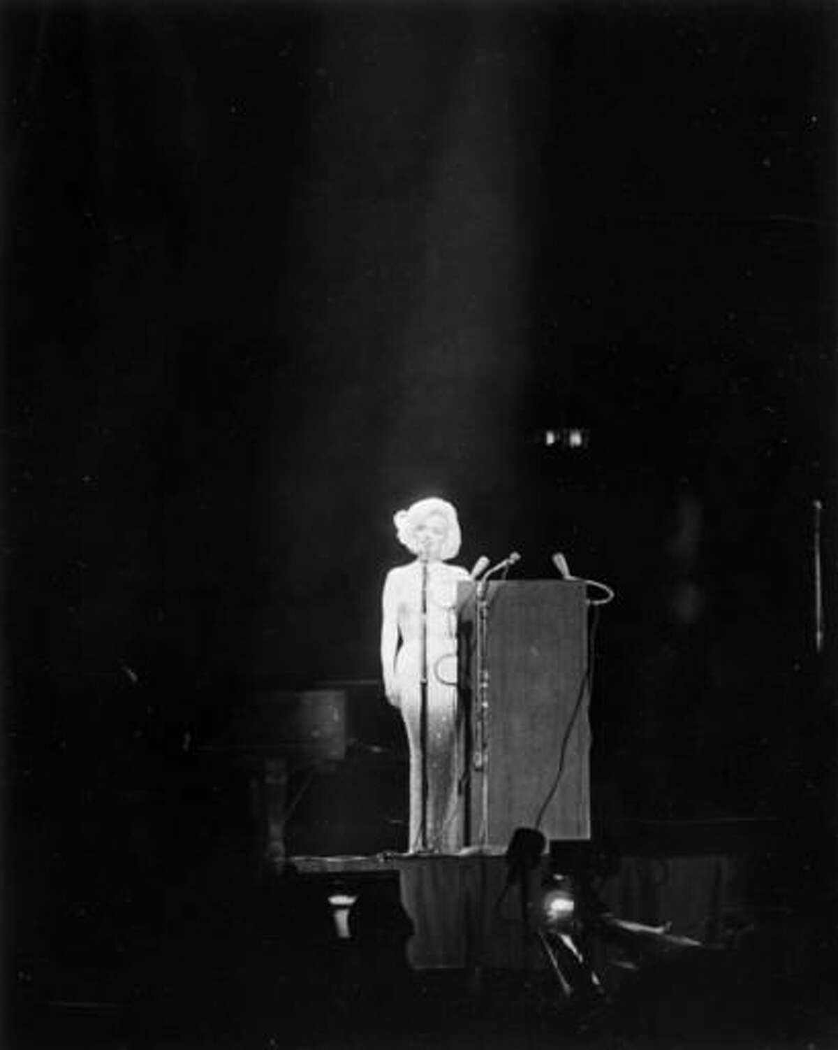 In this May 19, 1962 photo provided by the John F. Kennedy Presidential Library and Museum, actress Marilyn Monroe sings "Happy Birthday" to President Kennedy at his 45th birthday celebration at New York's Madison Square Garden. Julien's Auctions will offer the barely-there dress Monroe wore at the performance at an auction in Los Angeles on Nov. 17, 2016. (Cecil Stoughton/White House Photographs, John F. Kennedy Presidential Library and Museum via AP)