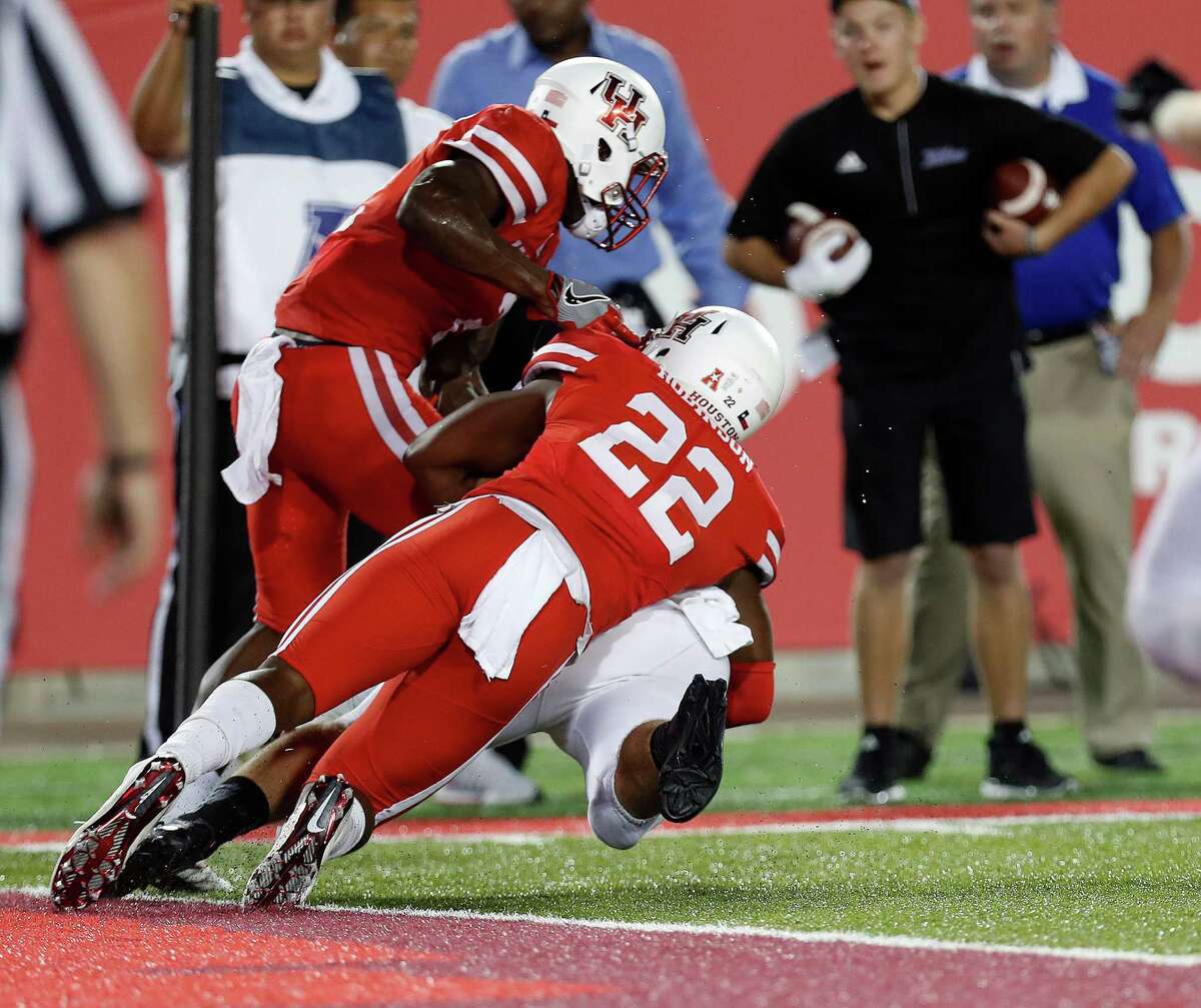 Austin Robinson's dramatic goal-line tackle preserved UH's win over Tulsa.