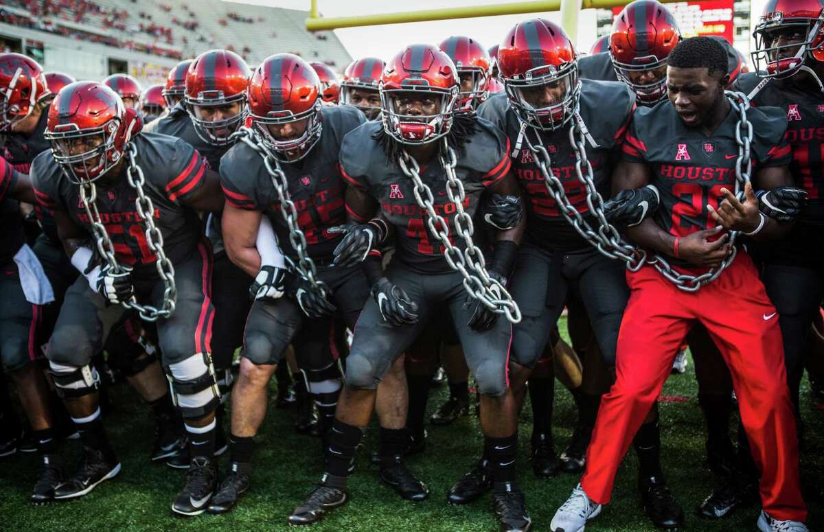 The Houston football team gather together before facing Connecticut in an NCAA football game at TDECU Stadium on Thursday, Sept. 29, 2016, in Houston. ( Brett Coomer / Houston Chronicle )