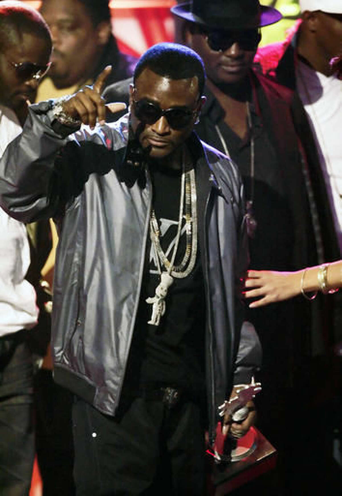 In this Oct. 18, 2008 file photo, Shawty Lo accepts the Rookie of the Year award during the BET Hip Hop Awards in Atlanta. Authorities say rapper Shawty Lo, whose real name is Carlos Walker, has been killed in a fiery car crash before dawn Wednesday, Sept. 21, 2016 on a freeway near southwest Atlanta. (AP Photo/John Amis, File)