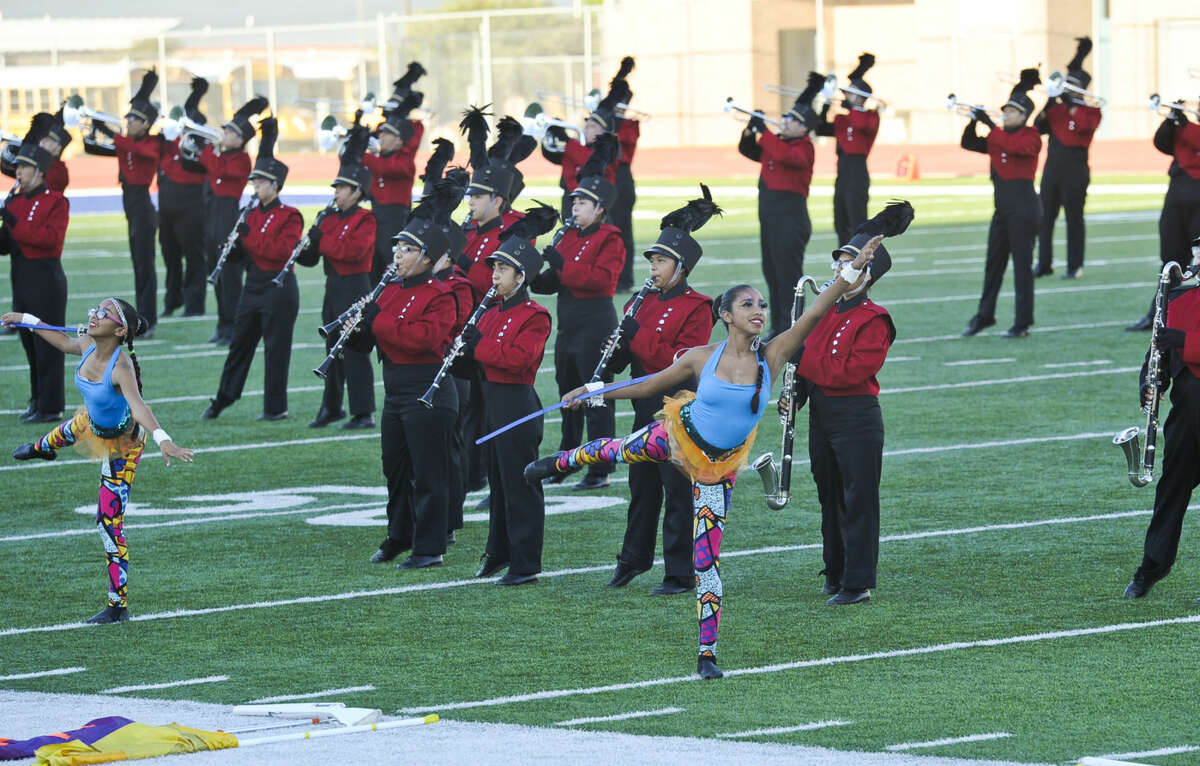 In this Oct. 4, 2014 file photo, the Martin High School Color Guard performs with the Martin High School marching band during the UISD Marching Band Festival at the Student Activity Complex.