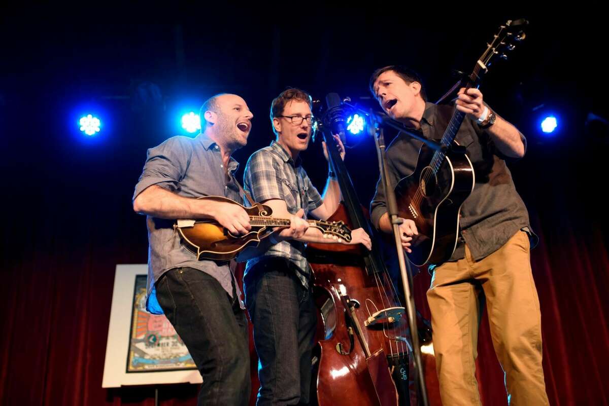The Lonesome Dove Trio, from left, Jacob Tilove, Ian Riggs and Ed Helms, perform during “Michael Daves’s All-Star Bluegrass Throw-Down” in New York, on Friday. The group writes old-timey songs with a droll contemporary perspective. Photo by Karsten Moran/The New York Times