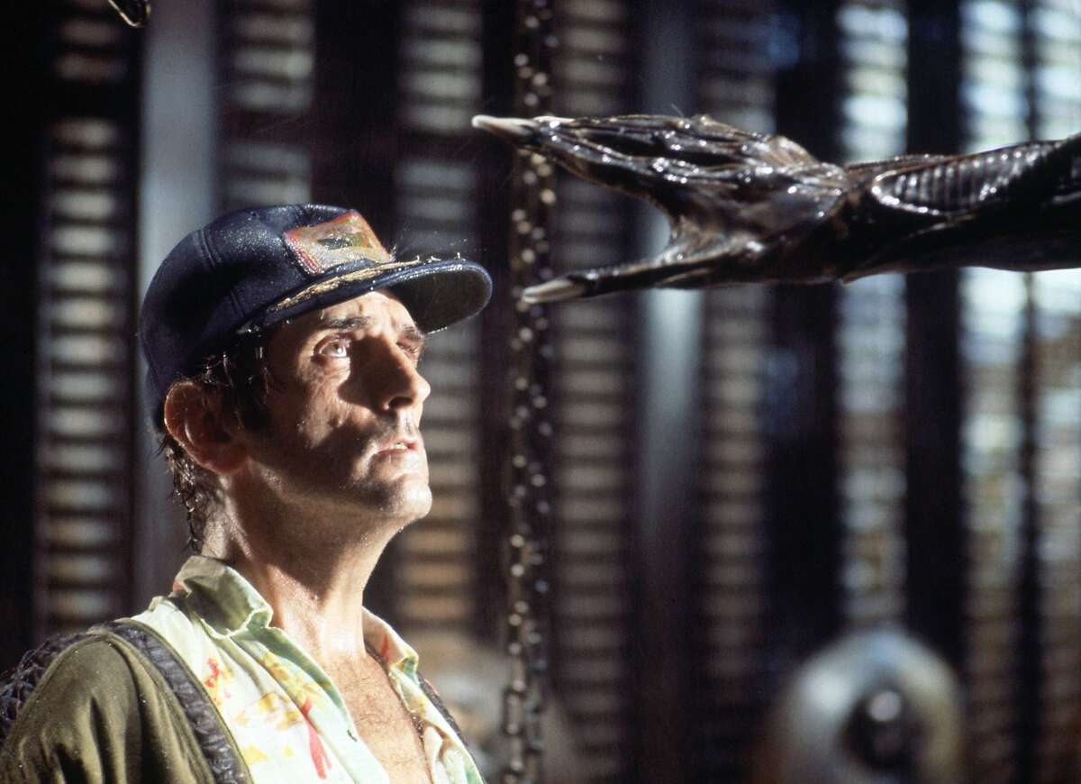 Actor Harry Dean Stanton faces an alien creature in a scene from the 1979 sci-fi-horror film "Alien," in this undated promotional photo.