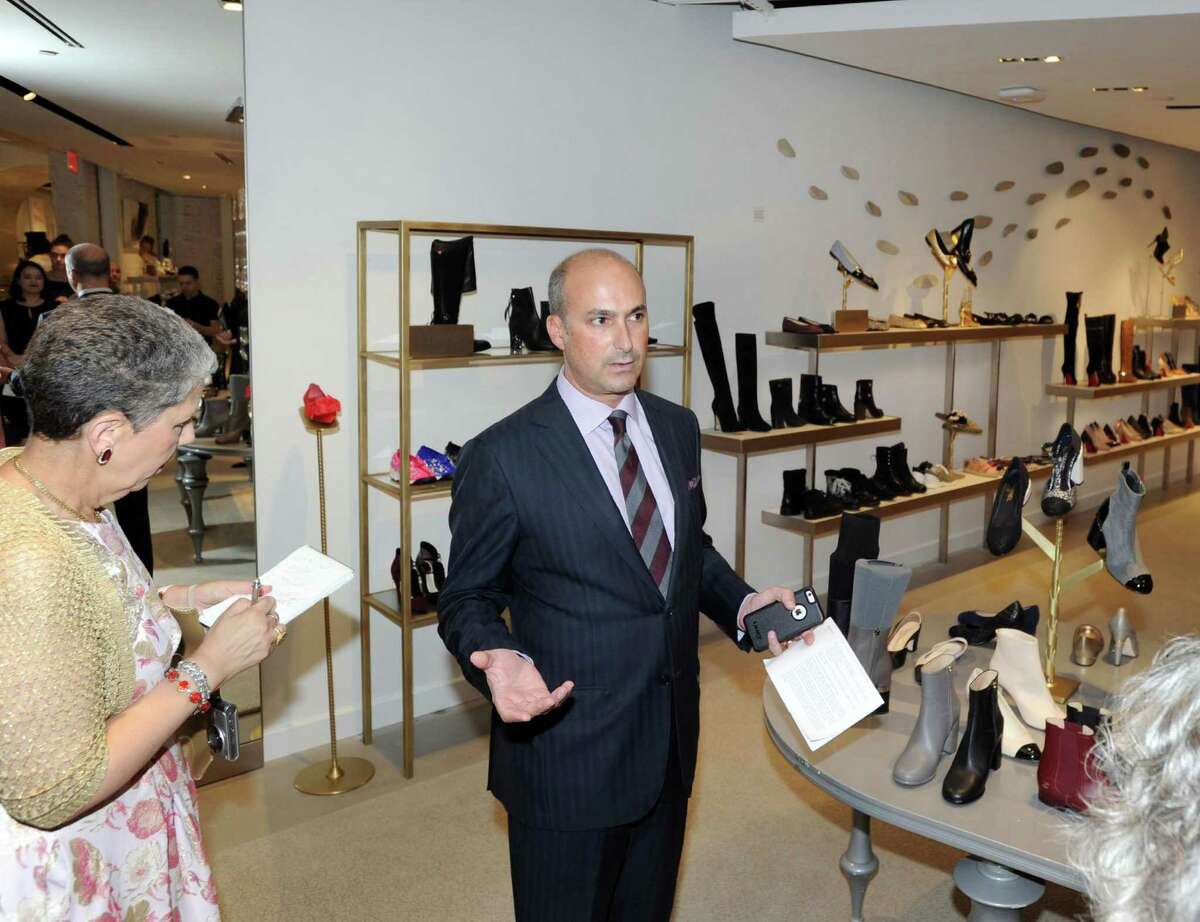 Joe Gambino, vice president and general manager of The Saks Shops at Greenwich, gives the preview tour of the new Saks Fifth Avenue standalone shoe store, 10022-Shoe Greenwich, the first of its kind for Saks, at 20 E. Elm St. in Greenwich on Wednesday.