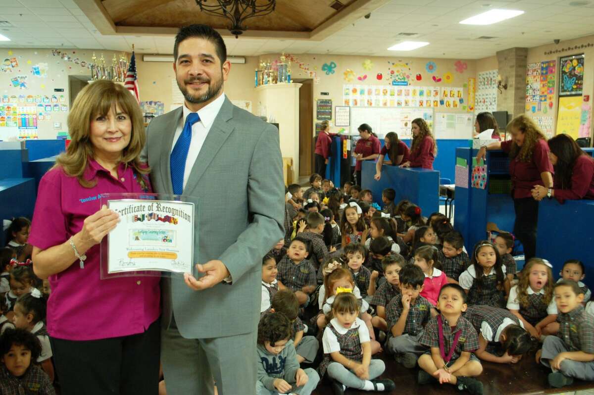 Laredo City Councilman poses with Annie Martinez, founded of Lollipop Learning Center.