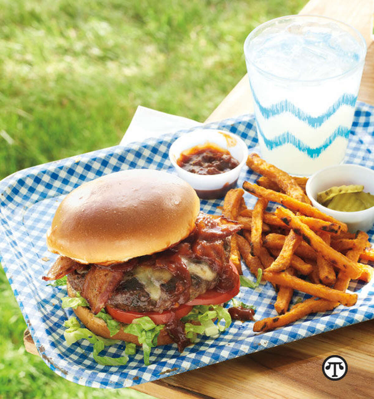 Bacon Cheeseburgers with Kentucky Bourbon Sauce can bring a delicious blend of BBQ styles to your next cookout. (NAPS)