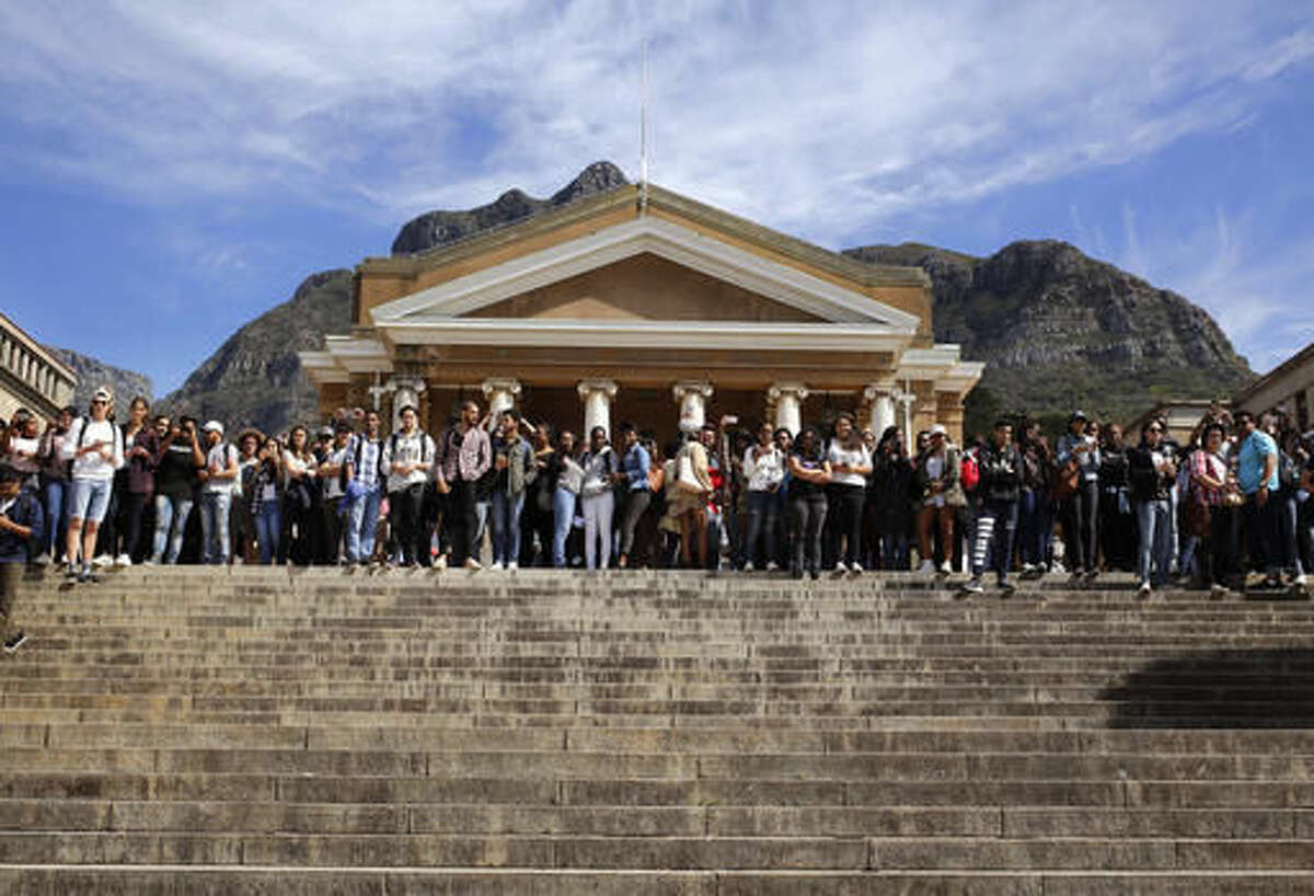 FILE - In this file photo dated Tuesday, Sept. 20, 2016, students gather at the University of Cape Town as they protest for free education in Cape Town, South Africa. Grievances over economic inequities are fueling unrest that has forced the closure of some of South Africa’s most prominent universities, with the government alleging a radical minority has brought campuses to a standstill over financing of higher education. (AP Photo/Schalk van Zuydam, FILE)