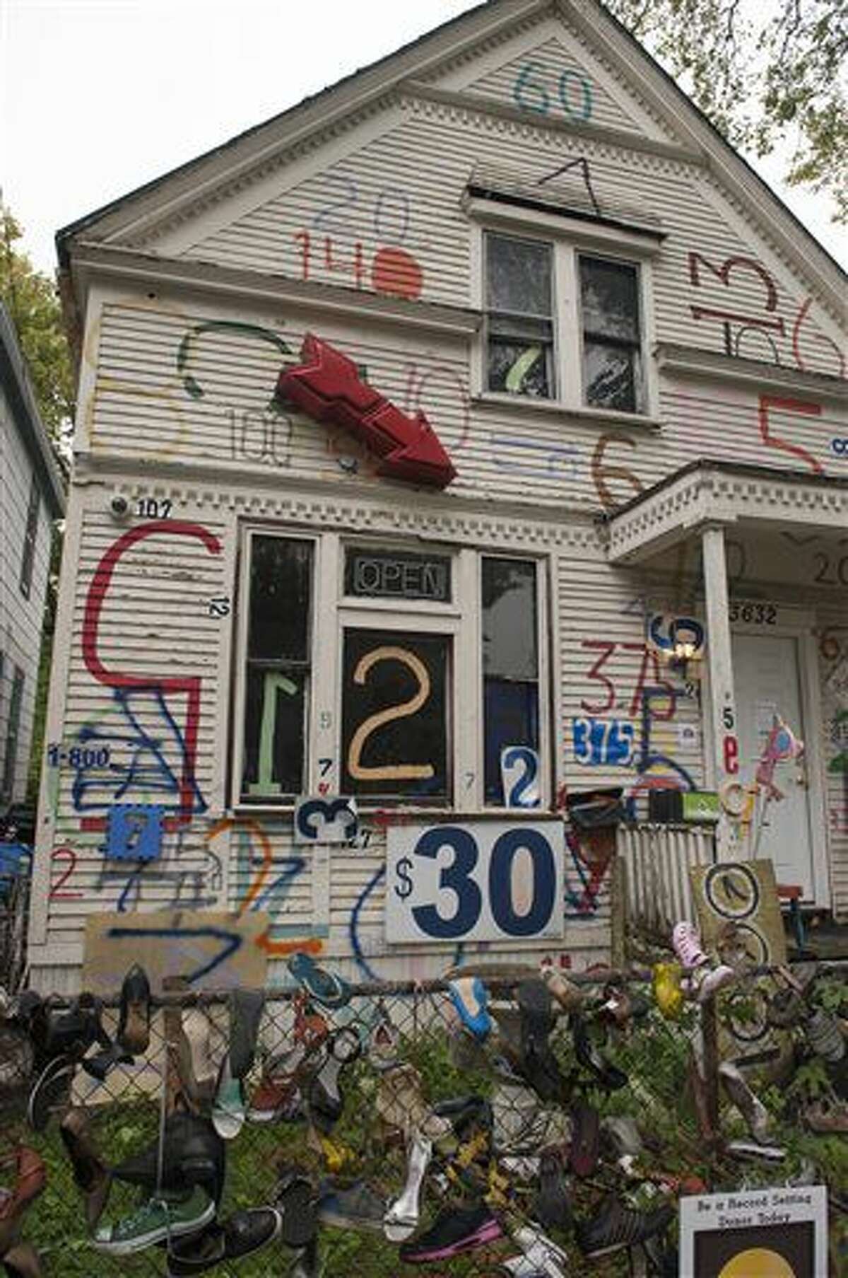 A Sept. 30, 2016 photo shows the exterior of the Number House at the Heidelberg Project, in Detroit. The Heidelberg Project in Detroit is launching a $100,000 capital campaign as its creator looks to remake and largely dismantle the outdoor art installation. (John T. Greilick/The Detroit News via AP)