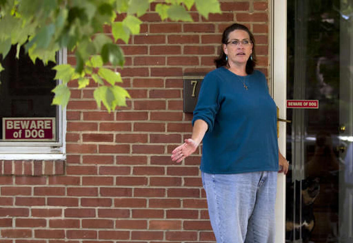 Debbie the wife of Harold Thomas Martin III, talks to reporters outside of her home in Glen Burnie, Md., Wednesday, Oct. 5, 2016. A federal government contractor is accused of stealing highly classified information. The Justice Department on Wednesday announced a criminal complaint against Harold Thomas Martin III of Glen Burnie, Maryland (AP Photo/Jose Luis Magana)