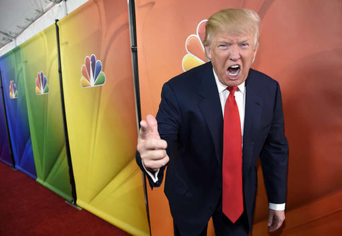 FILE - In this Jan. 16, 2015 file photo, Donald Trump, host of the reality television series "The Celebrity Apprentice," poses for photographers at the NBC 2015 Winter TCA Press Tour in Pasadena, Calif. In his years on the "The Apprentice," Trump repeatedly demeaned women with sexist language, according to show insiders who said he rated female contestants by the size of their breasts and talked about which ones he'd like to have sex with. (Photo by Chris Pizzello/Invision/AP, File)