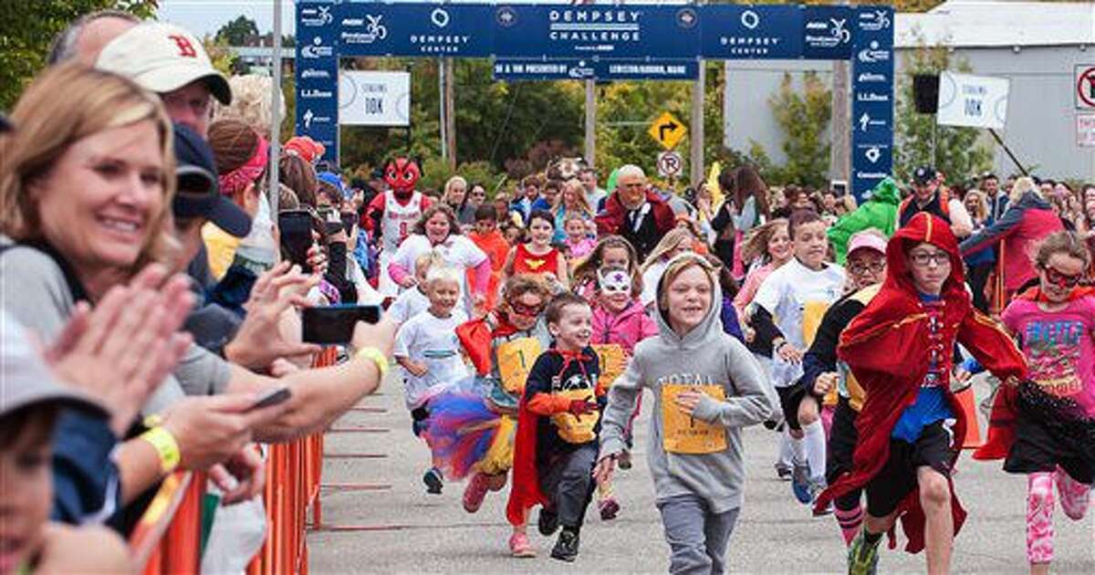 Children take part in the Kids’ Fun Run during the annual Dempsey Challenge Saturday, Oct. 1, 2016 in Lewiston, Maine. Patrick Dempsey, who plays a starring role in the new romance-comedy, "Bridget Jones's Baby," participated Saturday in a cancer survivor walk with his three children and two sisters. (Russ Dillingham/The Lewiston Sun-Journal via AP)