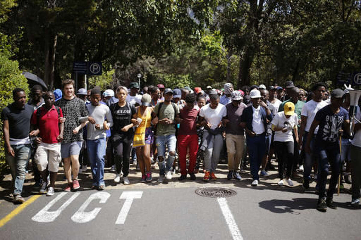 Students from the University of Cape Town attend a protest in Cape Town, South Africa, Tuesday, Oct. 4, 2016, demanding free university education. President Jacob Zuma has said the recent protests at some South African universities have caused about $44 million in property damage and threaten to sabotage the country's system of higher education. (AP Photo/Schalk van Zuydam)