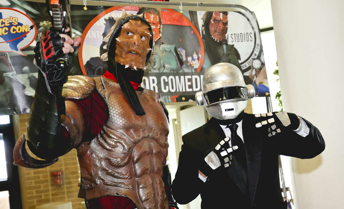 In this January 2015 file photo, comedian Alien Warrior, left, poses for a photo with Daft Punk cosplayer Adrian Salcedo during the South Texas Collector's Expo Comic Con at the TAMIU Student Center.