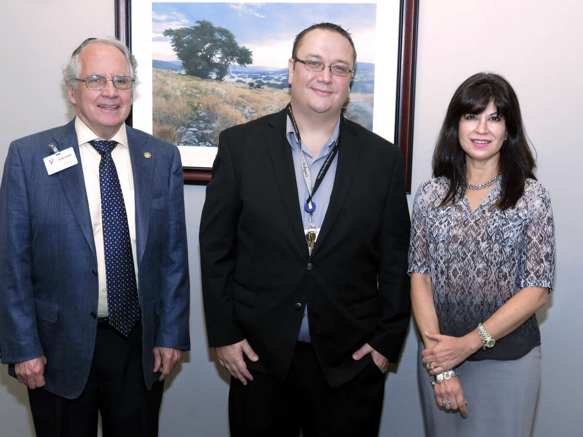 Convergys General Manager Michael Tufts, center, met, Wednesday at his office with Laredo Development Foundation Board of Directors President Bill Green, who is also the Laredo Morning Times publisher, and foundation Executive Director Olivia Varela.
