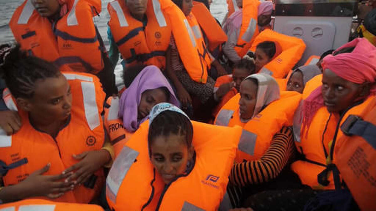 A rescue boat is filled with migrants taken from a vessel in the Mediterranean Sea off the coast of Libya in this Tuesday Oct. 4, 2016 image taken from video. At least 33 people died on Tuesday trying to reach Europe by crossing the Mediterranean Sea from Libya.(AP Photo)