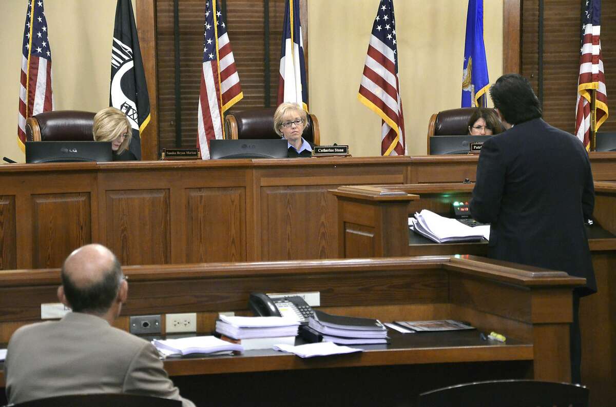 Texas Fourth Court of Appeals members, from left, Justice Sandee Bryan Marion, Chief Justice Catherine Stone and Justice Patricia O. Alvarez preside as local attorney Baldemar Garcia Jr., at podium, presents his arguments in a case involving Dr. Hector Farias representing VIDA (Voices in Democratic Actions) and local businessman Eduardo Garza. The case was heard Thursday morning at the Commissioners Courtroom at the Webb County Courthouse.