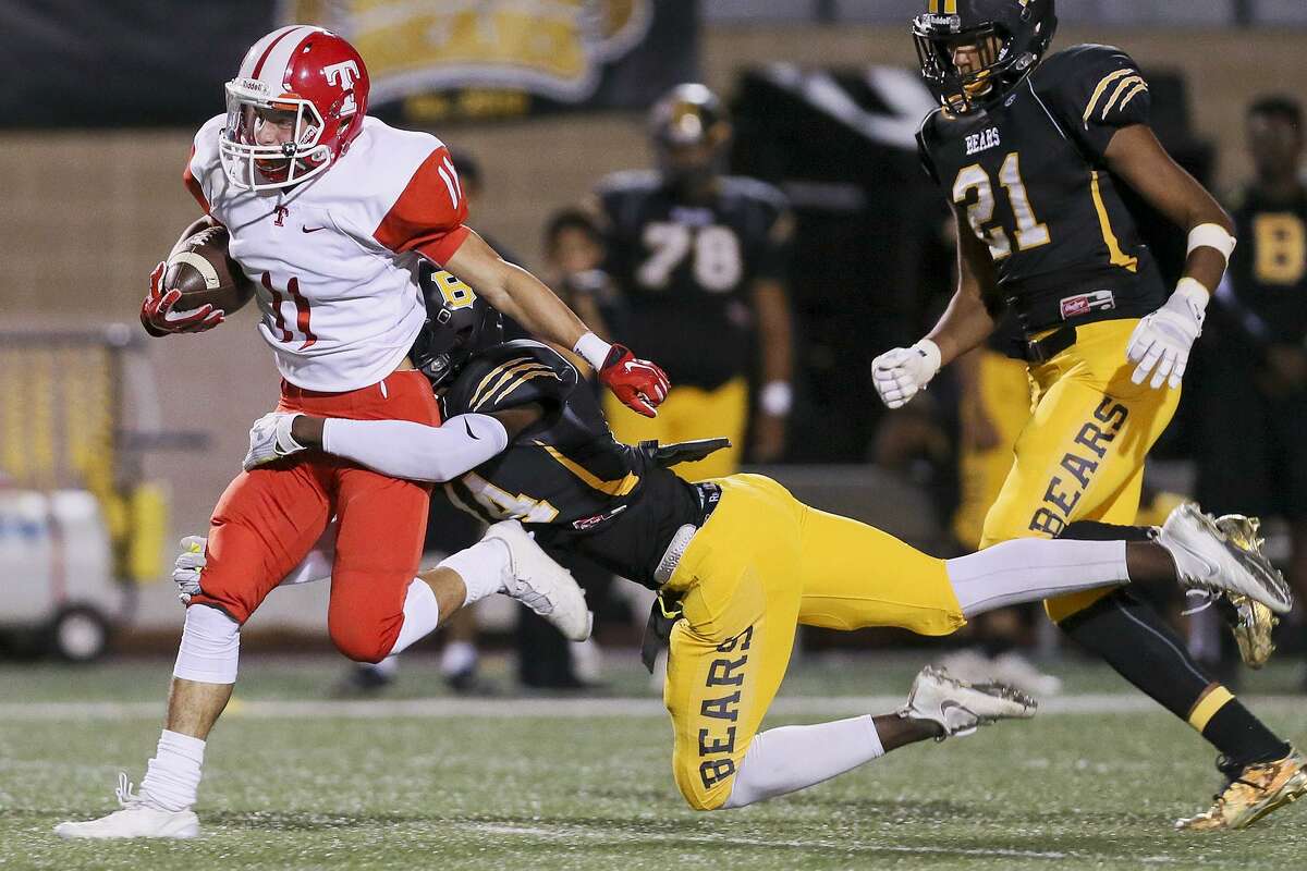 FILE PHOTO: Taft's Martin Ramirez tries to break free from Brennan's KJakory Lewis on a long catch-and-run during the second half of their District 28-6A high school football game at Farris Stadium on Thursday, Oct. 20, 2016. Brennan beat Taft 42-7. MARVIN PFEIFFER/ mpfeiffer@express-news.net