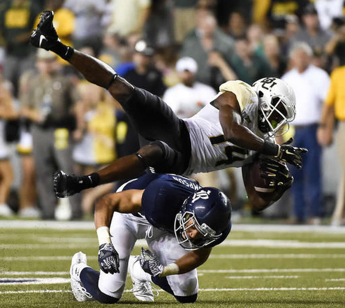 Baylor wide receiver Chris Platt, top, is hit by Rice safety J.P. Thompson in the second half of an NCAA college football game, Friday, Sept. 16, 2016, in Houston. (AP Photo/Eric Christian Smith)