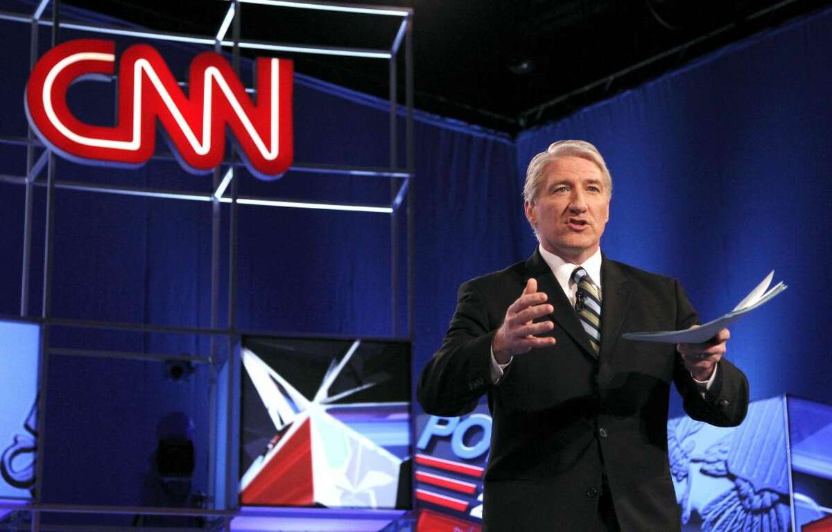This Feb. 22, 2012 file photo shows moderator and CNN correspondent John King. CNN is canceling John King's evening news show, making him the first victim of the network's bad stretch in the ratings. "JK USA" has aired at 6 p.m. ET since 2010. CNN said Wednesday that Wolf Blitzer's "Situation Room" would expand to three hours, and King will become the network's lead national campaign correspondent. (AP Photo/Ross D. Franklin, file)