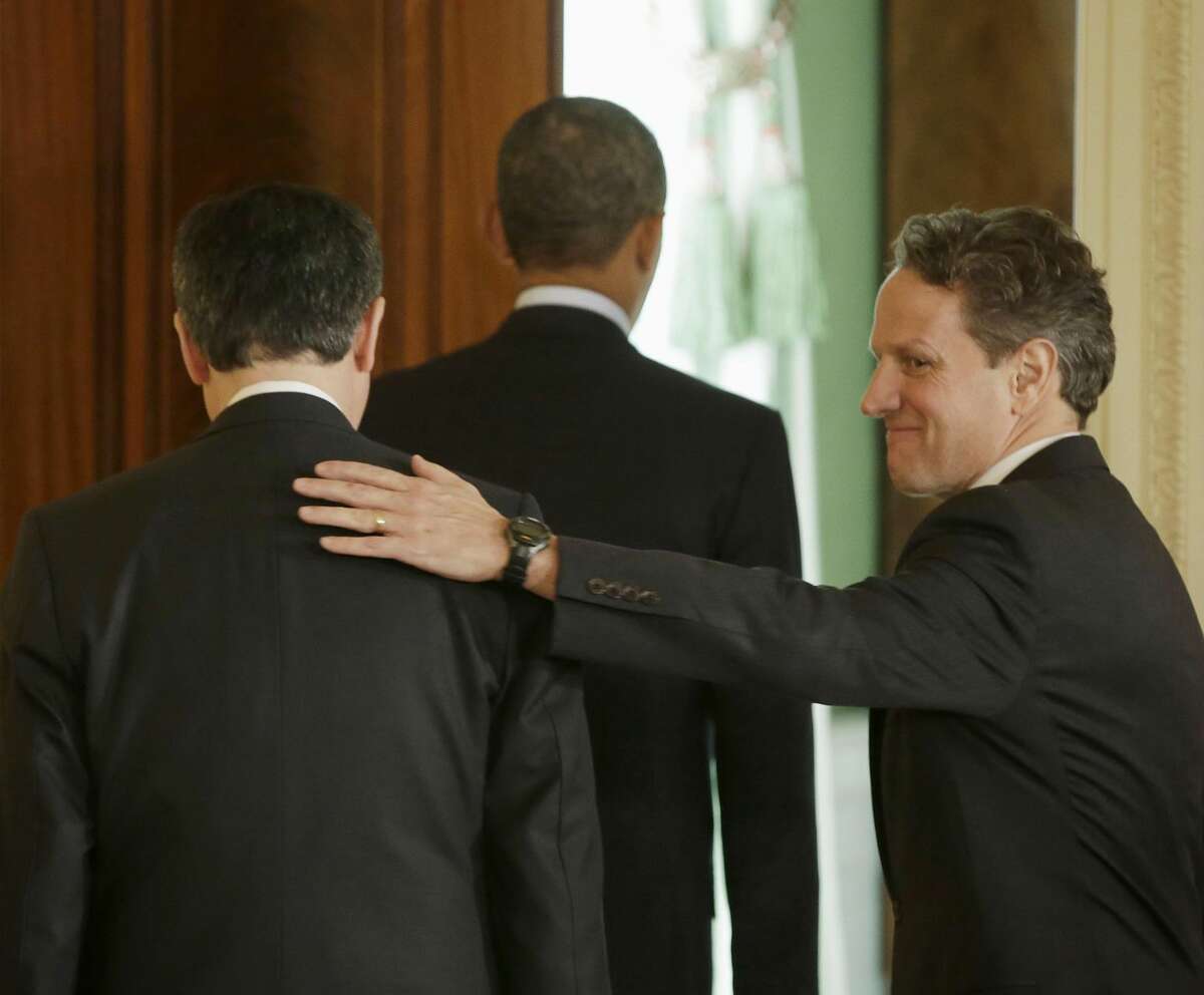 Outgoing Treasury Secretary Timothy Geithner, right, pats the back of current Chief of Staff Jack Lew, left, as they walk out with President Barack Obama from the East Room of the White House in Washington, Thursday, Jan. 10, 2013, after Obama announced he will nominate Lew to succeed Geithner as treasury secretary. (AP Photo/Pablo Martinez Monsivais)