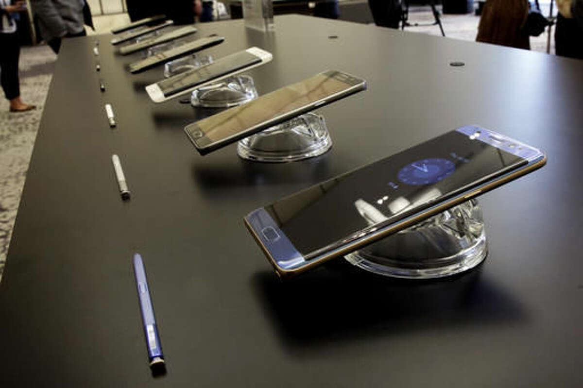 FILE - In this July 28, 2016, file photo, the Galaxy Note 7, foreground, is displayed in New York. U.S. regulators issued an official recall of Samsung's Galaxy Note 7 phone on Thursday, Sept. 15, 2016, because of a risk of fire. (AP Photo/Richard Drew, File)