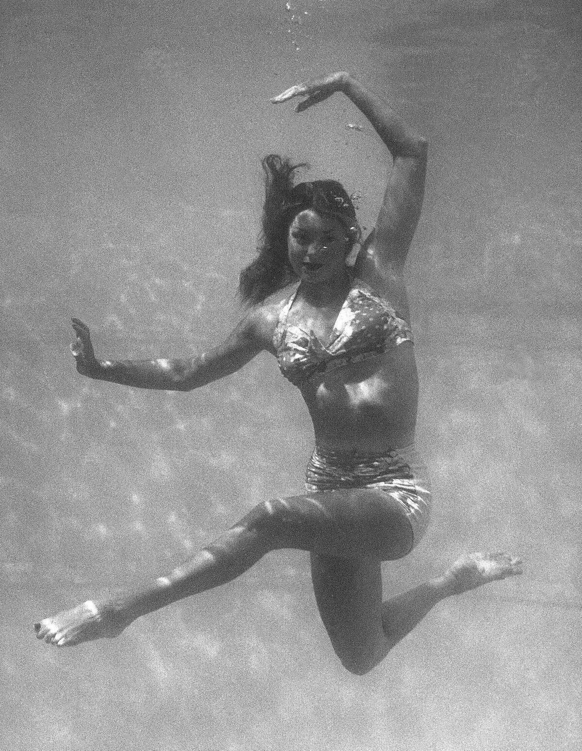This June 1944 file photo shows actress and swimmer Esther Williams rehearsing her underwater-ballet for the motion picture musical "Ziegfeld Follies" in Los Angeles. According to a press representative, Williams died in her sleep on Thursday, June 6, 2013, in Beverly Hills, Calif. She was 91. (AP Photo, file)
