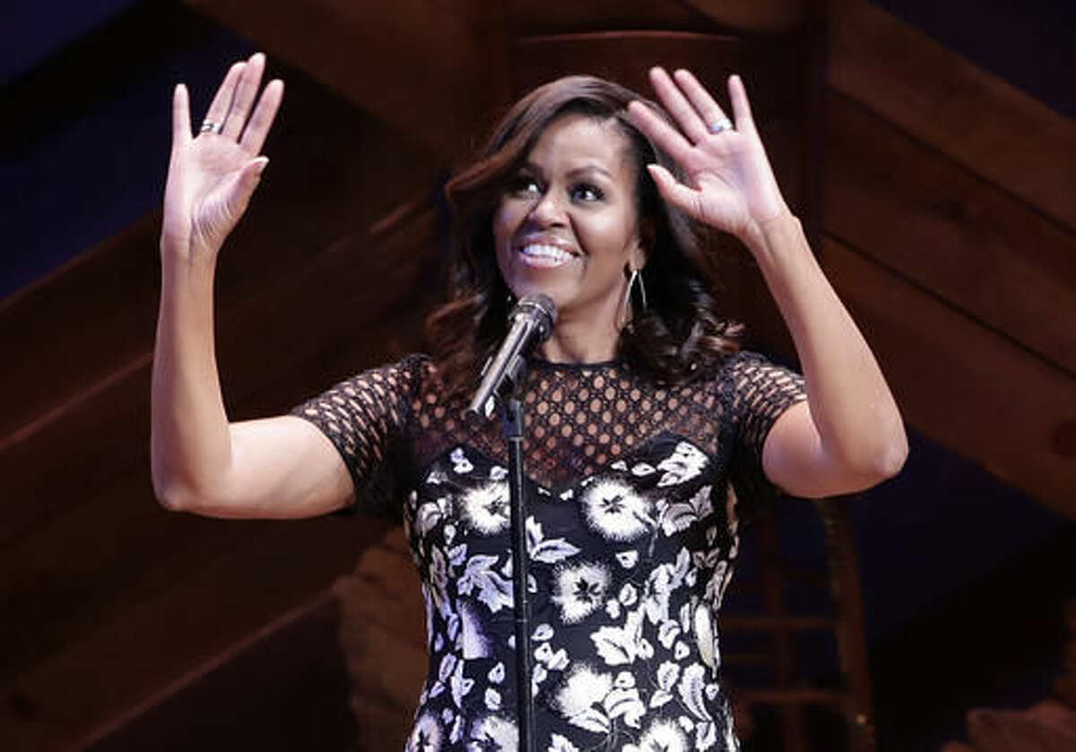 First lady Michelle Obama reacts to applause as she hosts Broadway Shines A Light on Girls' Education, Monday, Sept. 19, 2016, at the Bernard B. Jacobs Theatre in New York. (AP Photo/Frank Franklin II)