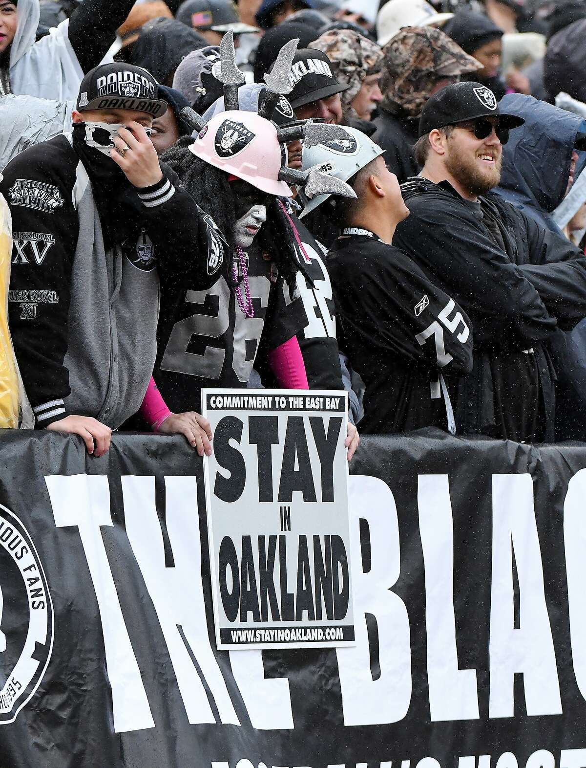 The Oakland Raiders Black Hole fan section in the fourth quarter during a game against the Kansas City Chiefs on Sunday, Oct. 16, 2016 at O.co Coliseum in Oakland, Calif. (John Sleezer/Kansas City Star/TNS)