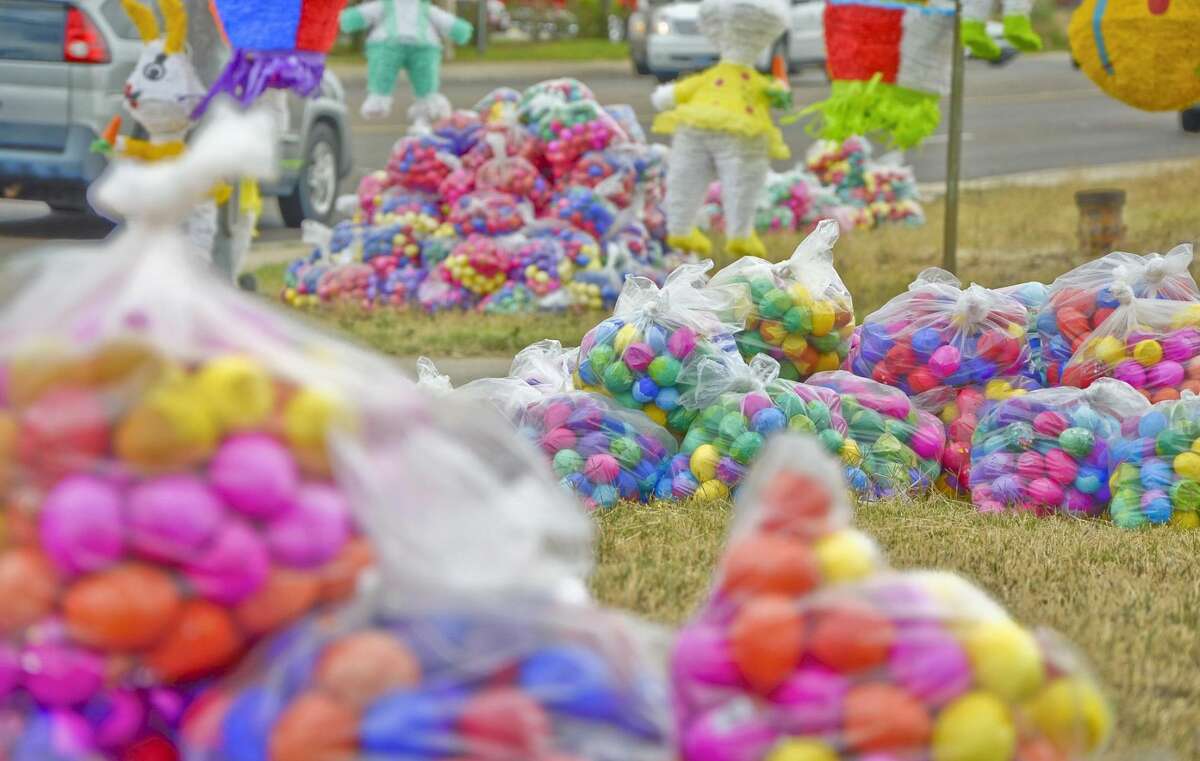 Piles of bags filled with Easter eggs, or "cascarones," sit on the side of the road, where vendors set up shop Friday afternoon at the intersection of McPherson and Jacaman roads. (Photo by Danny Zaragoza/Laredo Morning Times)