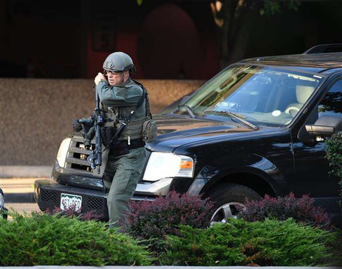 A Denver hospital complex was placed on lockdown Friday, Sept. 16, 2016, after a report that a man was seen carrying a rifle on the complex grounds. There was no confirmation that shots had been fired or anyone was injured at Rose Medical Center, police spokeswoman Raquel Lopez said. Hospital officials say no one there was hurt. (Andy Cross/The Denver Post via AP)