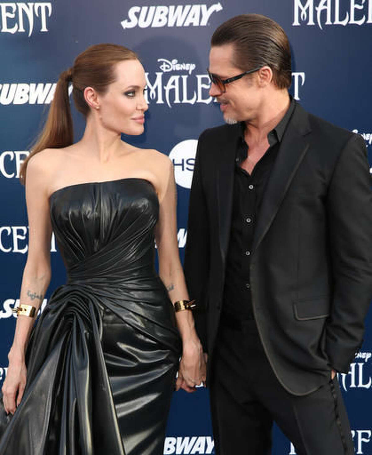 FILE - In this May 28, 2014 file photo, Angelina Jolie and Brad Pitt arrive at the world premiere of "Maleficent" in Los Angeles. Angelina Jolie Pitt has filed for divorce from Brad Pitt, bringing an end to one of the world's most star-studded, tabloid-generating romances. An attorney for Jolie Pitt, Robert Offer, said Tuesday, Sept. 20, 2016, that she has filed for the dissolution of the marriage. (Photo by Matt Sayles/Invision/AP, File)