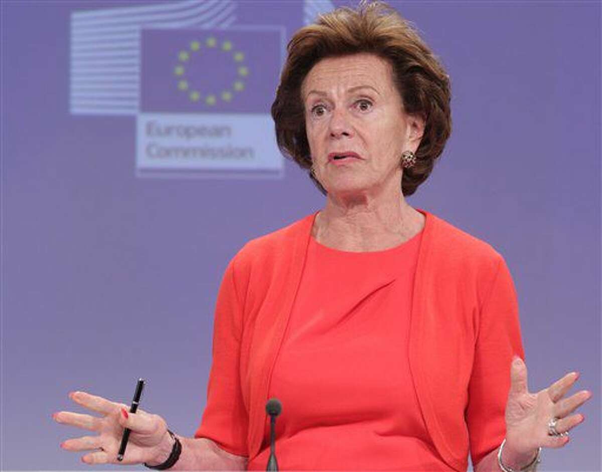 FILE - In this Monday, June 30, 2014 file photo, the then European Commissioner for Digital Agenda Neelie Kroes addresses the media, at the European Commission headquarters in Brussels. Kroes was one of the most high-profile names that emerged in a cache of documents of the Bahama's corporate registry leaked Wednesday Sept. 21, 2016 by the International Consortium of Investigative Journalists and media partners. (AP Photo/Yves Logghe, File)