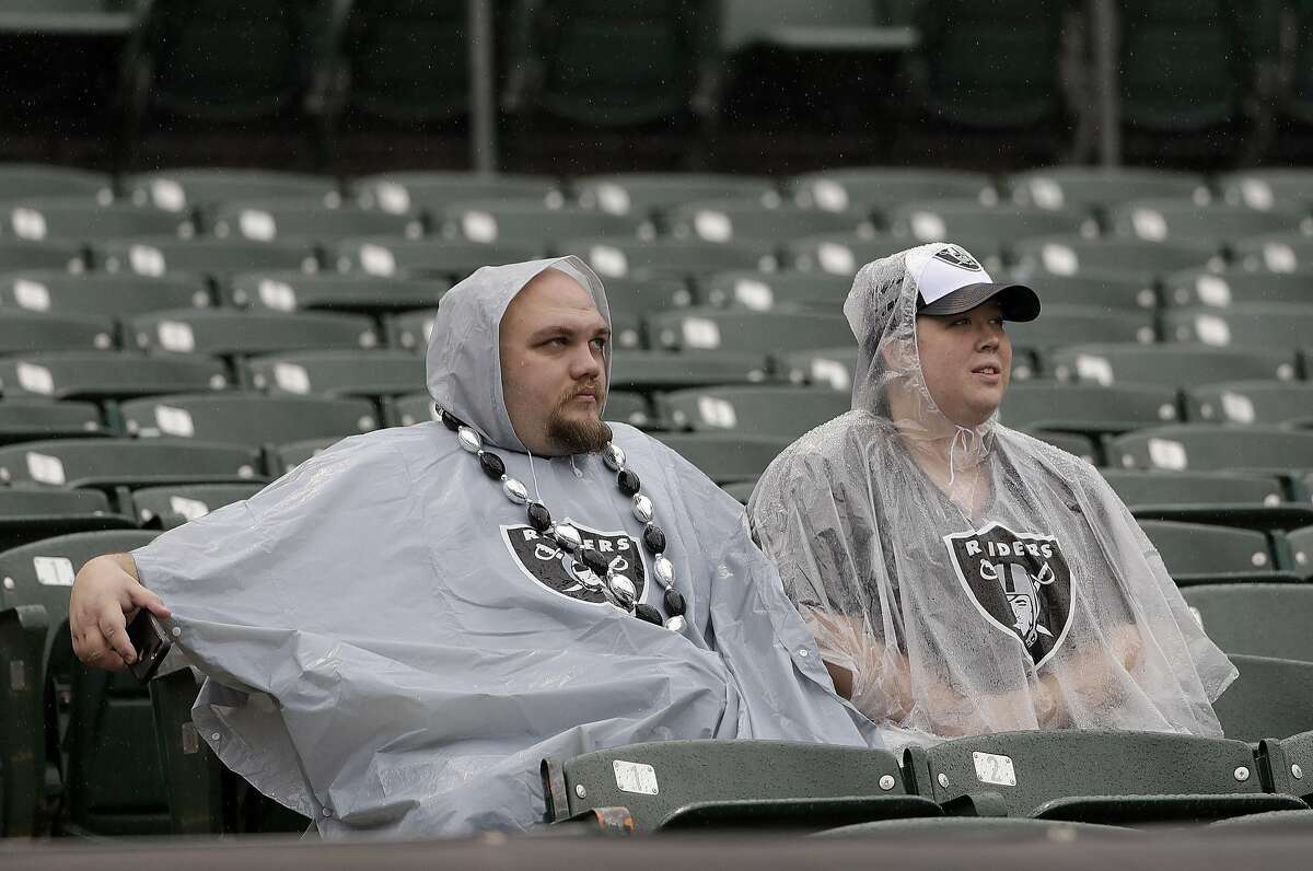Oakland Raiders fans are shown before an NFL football game between the Oakland Raiders and the Kansas City Chiefs in Oakland, Calif., Sunday, Oct. 16, 2016. (AP Photo/Marcio Jose Sanchez)