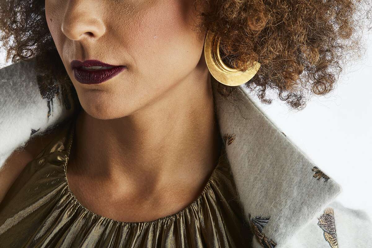 Closeup of a Marge by Kaersten Cooper gown, and coat and Marni earrings, $415.