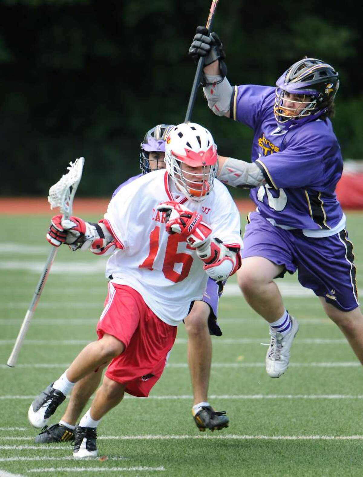 Greenwich High School's Jake Stein controls the ball with pressure from Westhill High School's Tom McCartney and Mike Suchochi in boys lacrosse in Greenwich, Conn. on Saturday May 15, 2010.