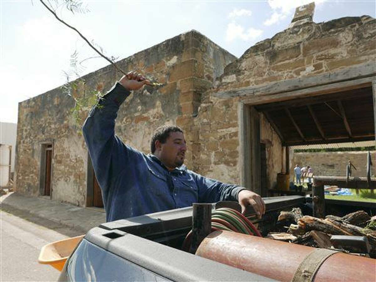 Jose Orlando Villarreal, whose family has lived for seven generations in San Ygnacio, Texas, works on the Treviño-Uribe Ranch, whose first structure was built in 1830. It is now being restored by local artisans. Wednesday, Sept. 15, 2016. (Billy Calzada/San Antonio Express-News via AP)