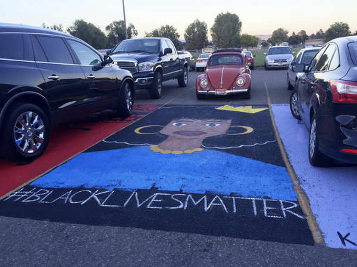 This Monday, Sept. 19, 2016 photo provided by kboi2.com shows a mural that school administrators at Mountain Home High School In southern Idaho say has to be removed because its placement in a school parking lot violates school policy. About 100 students have started a protest amid concerns the "Black Lives Matter" message of the art is the real reason officials want it gone. (kboi2.com via AP)