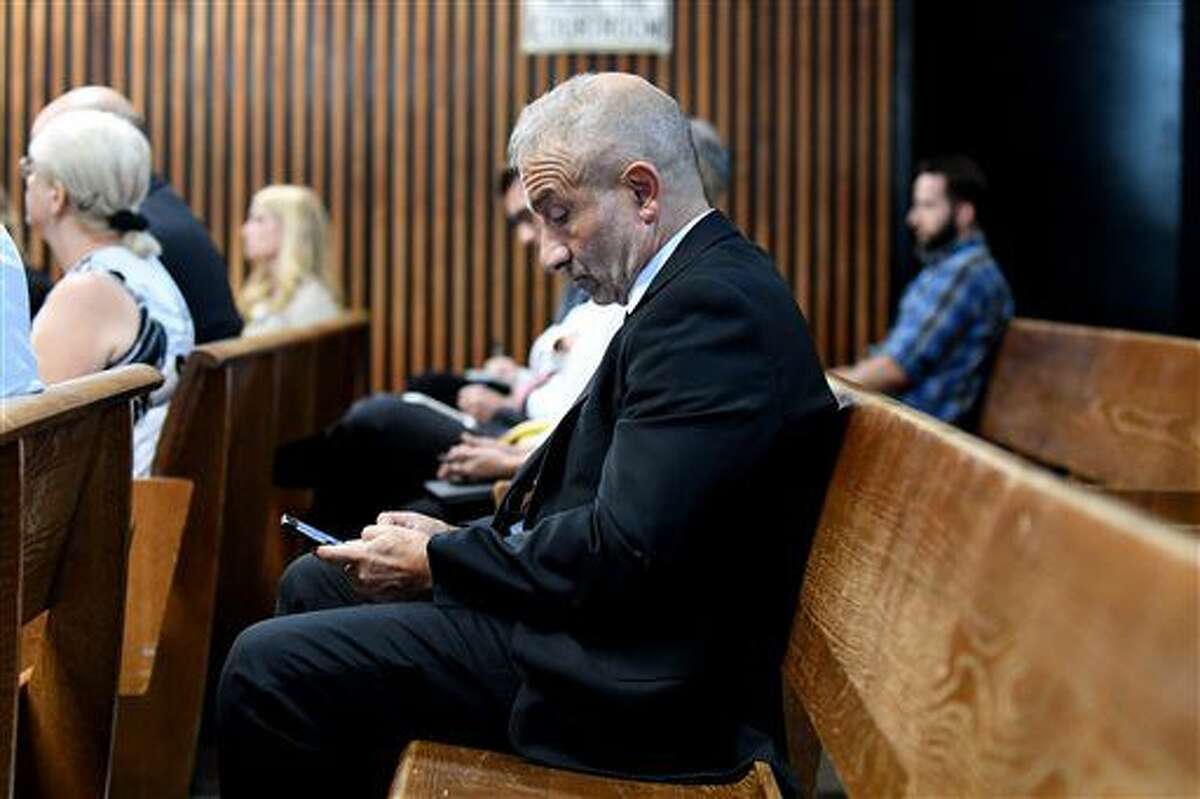 Alain Kaloyeros, president of SUNY Polytechnic Institute awaits his arraignment on state charges while sitting in a courtroom at Albany City Courthouse on Friday, Sept. 23, 2016, in Albany, N.Y. The state complaint alleges Kaloyeros agreed to steer construction contract awards to hand-picked companies. (Will Waldron/The Albany Times Union via AP)