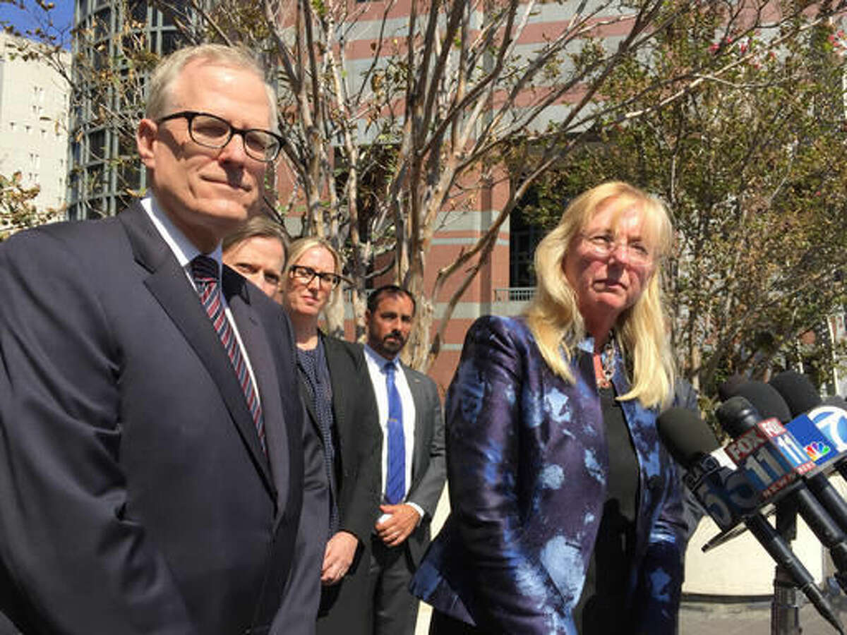 U.S. Attorney Eileen Decker, right, and prosecutors in her office address reporters outside federal court in Los Angeles on Tuesday, Sept. 6, 2016. Prosecutors reached a plea agreement with Paul Ciancia, not seen, who pleaded guilty to carrying out a fatal shooting at Los Angeles International Airport in 2013. (AP Photo/Amanda Lee Myers)