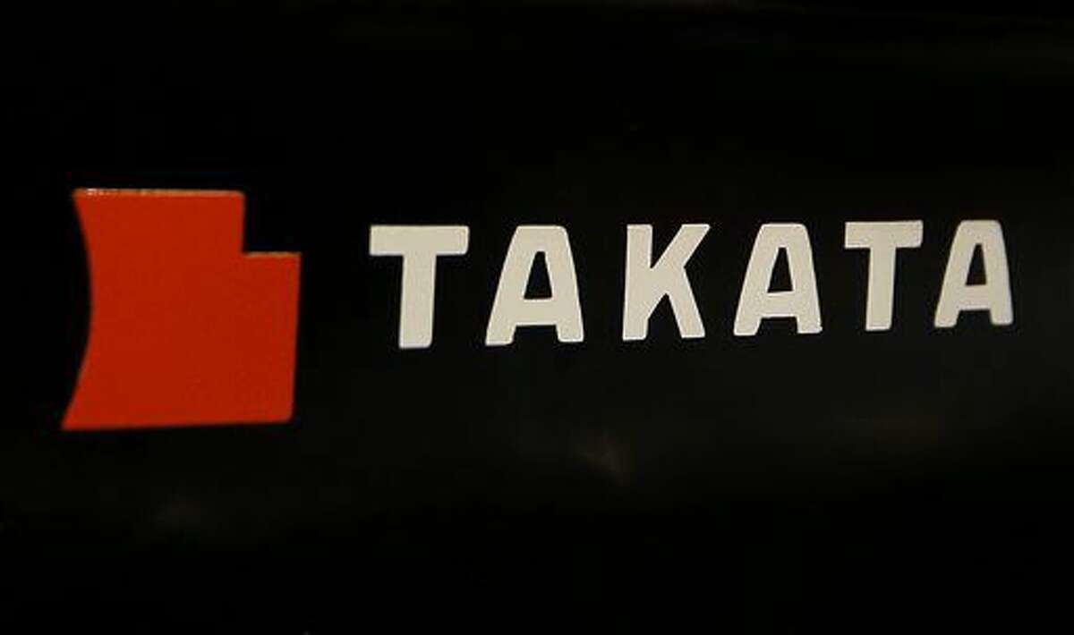FILE - This July 6, 2016, file photo, shows the logo of Takata Corp. at an auto supply shop in Tokyo. BMW is recalling 4,000 SUVs in the U.S. and Canada to fix a new and potentially deadly problem with Takata air bag inflators. The company says in government documents that the driver’s front inflator can separate from a plate, shooting out metal and other debris. Dealers will replace the driver’s air bag at no cost starting Nov. 11, 2016. (AP Photo/Shizuo Kambayashi, File)